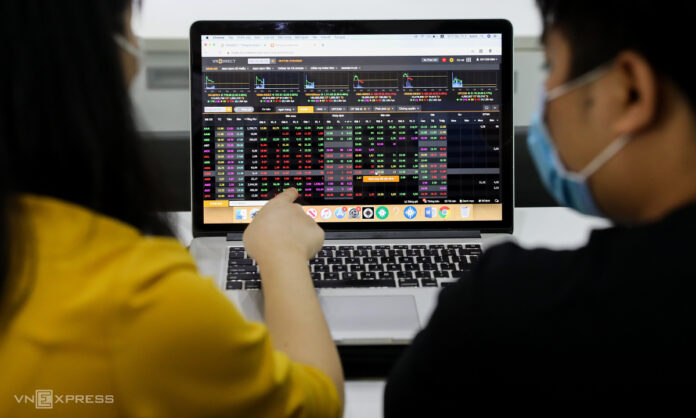 Analyzing stock market data on laptop.