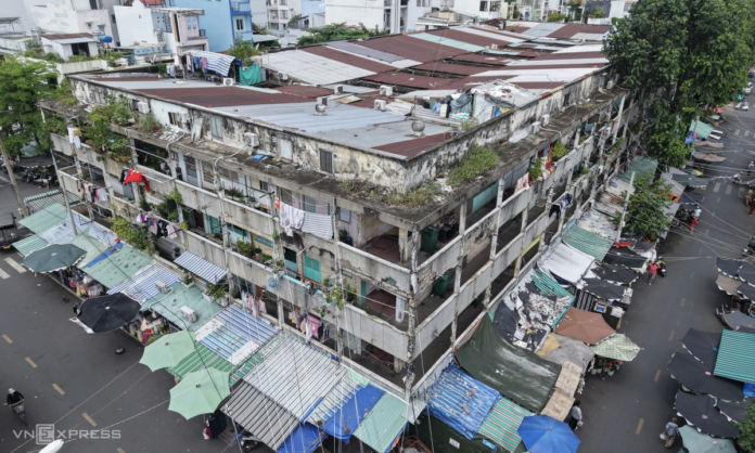 Dilapidated building with market below.